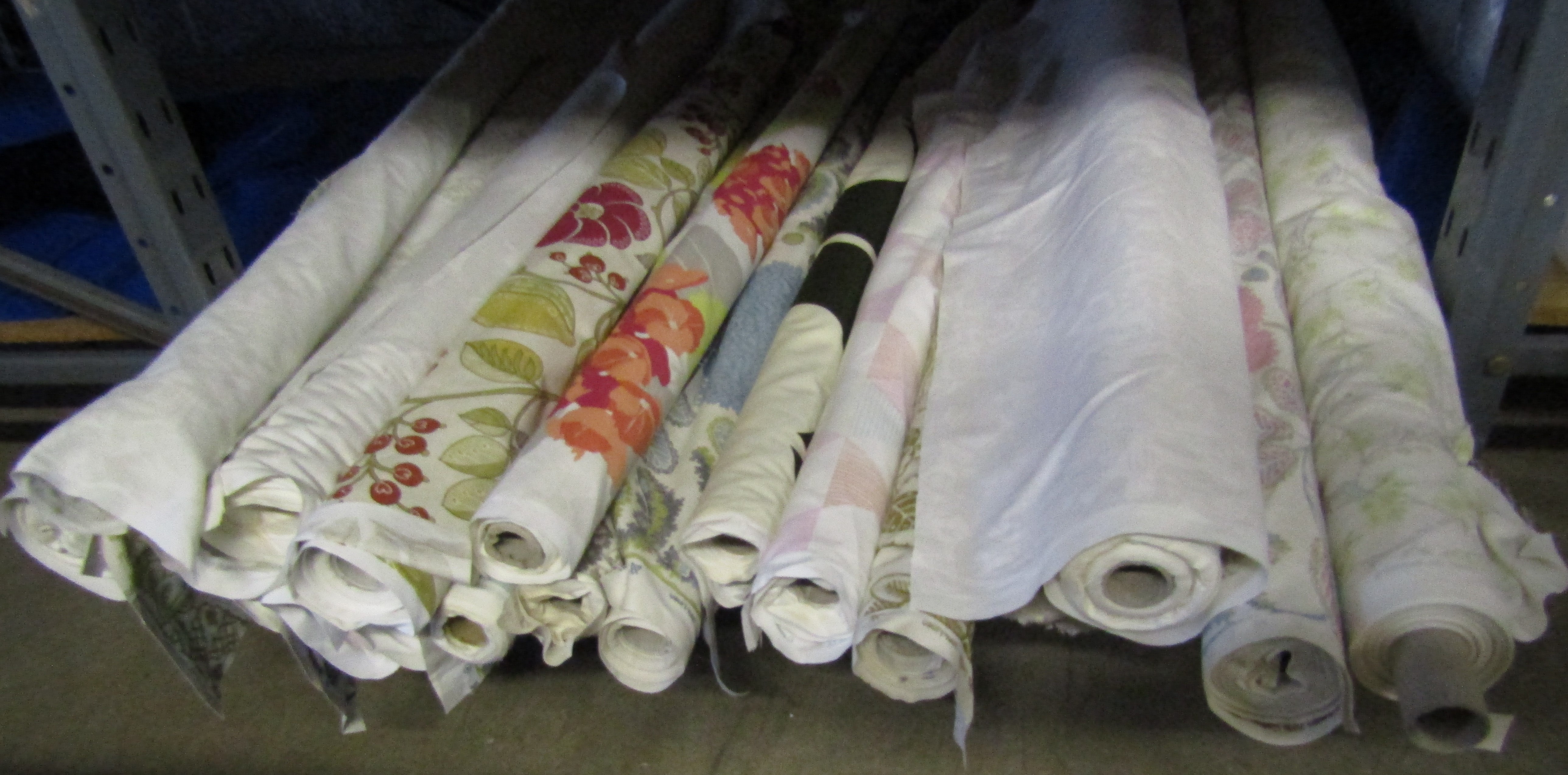 Approx. 18 rolls of mostly patterned fabric all Clarke & Clarke