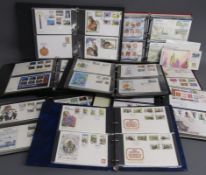 8 albums containing Alderney, Guernsey and Isle of man First day Covers - also some loose PHQ and
