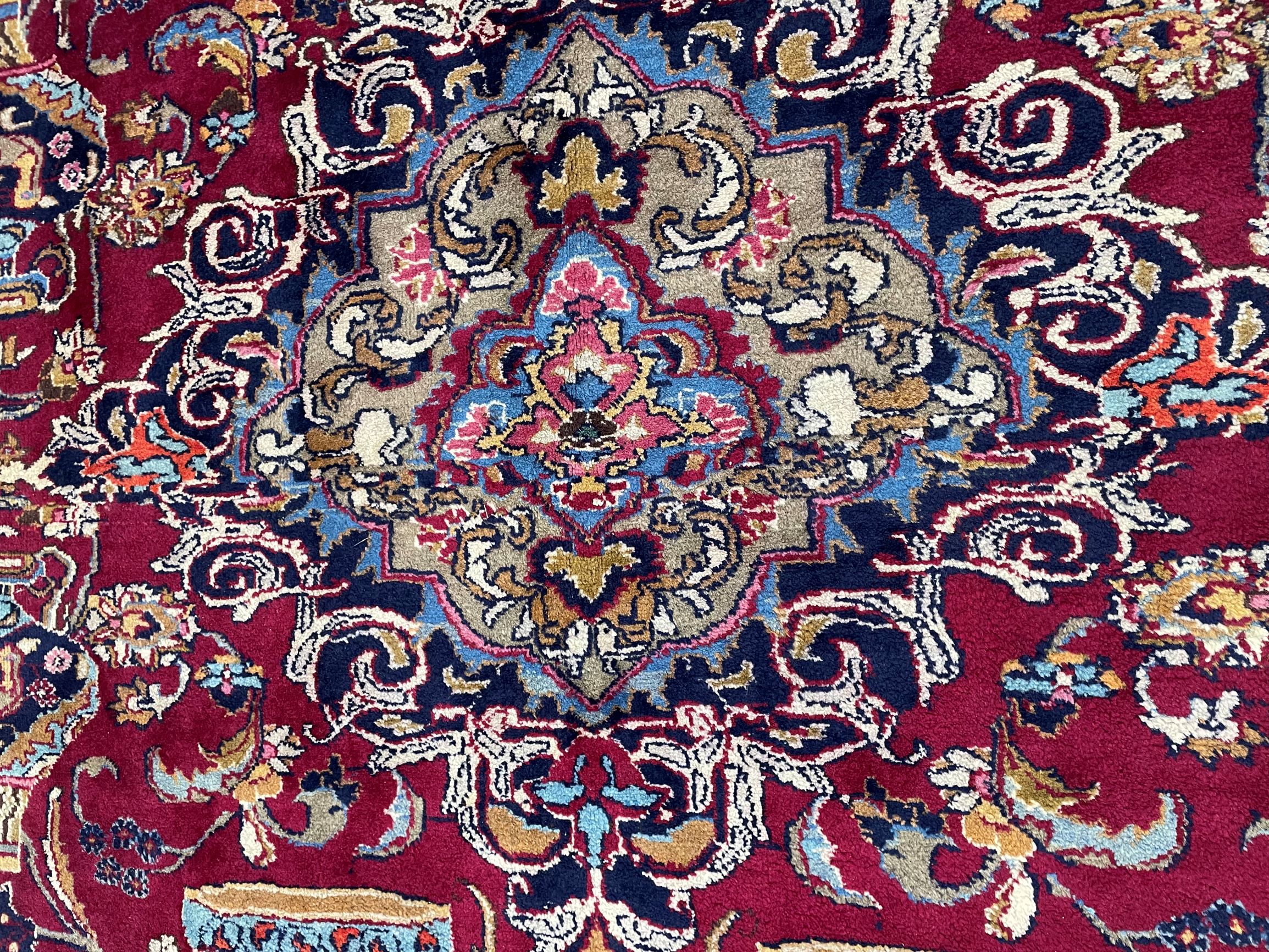 Large claret ground Persian Kashmar carpet with unique under earth design depicting vases & bowls - Image 2 of 2