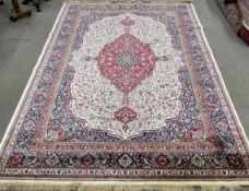 Large ivory ground cashmere carpet with floral medallion  design 330cm by 235cm