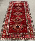 Rusty red multi-coloured  field full pile Persian runner with medallion design 287cm by 160cm