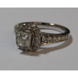 18ct white gold diamond ring with central princess cut 0.60ct diamond measuring 4.73 x 4.51 x 3.