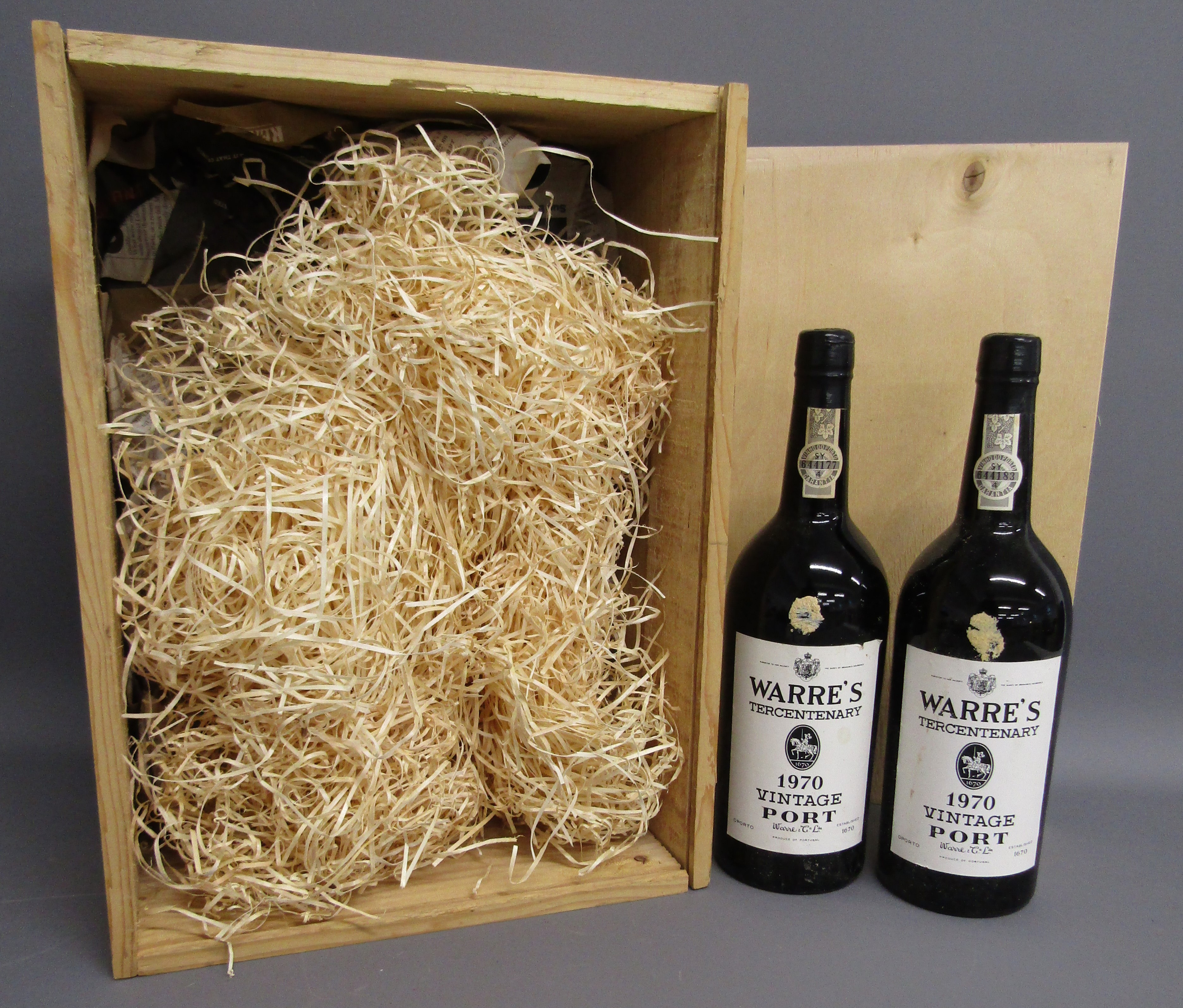 2 bottles of Warre's 1970 Tercentenary vintage Port still with wax seals intact and wooden crate