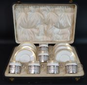 Cased set of Wedgwood coffee cans & saucers (pattern number Z4961) with pierced silver holders,