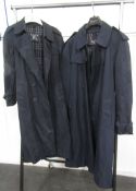 His and Hers navy Burberry trench coats