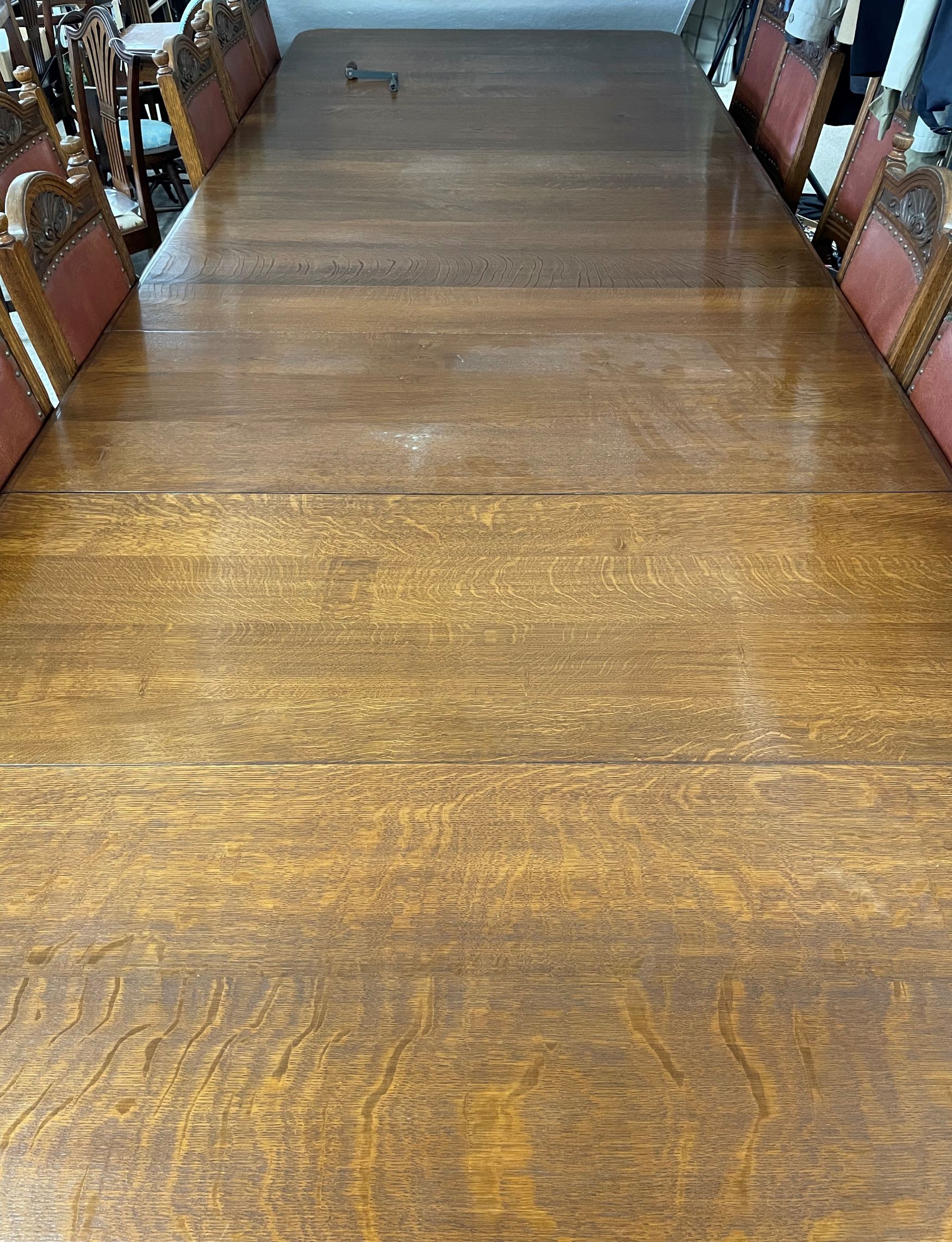 An extremely large late Victorian oak wind out dining table with 5 leaves and cabinet for leaves. - Image 6 of 6