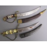 2 Gurkha Kukri knives - one with bone and brass handle and one with mother of pearl and brass handle