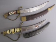 2 Gurkha Kukri knives - one with bone and brass handle and one with mother of pearl and brass handle