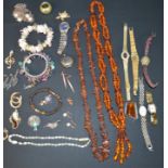 Selection of costume jewellery including amber necklaces