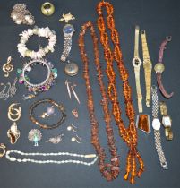 Selection of costume jewellery including amber necklaces