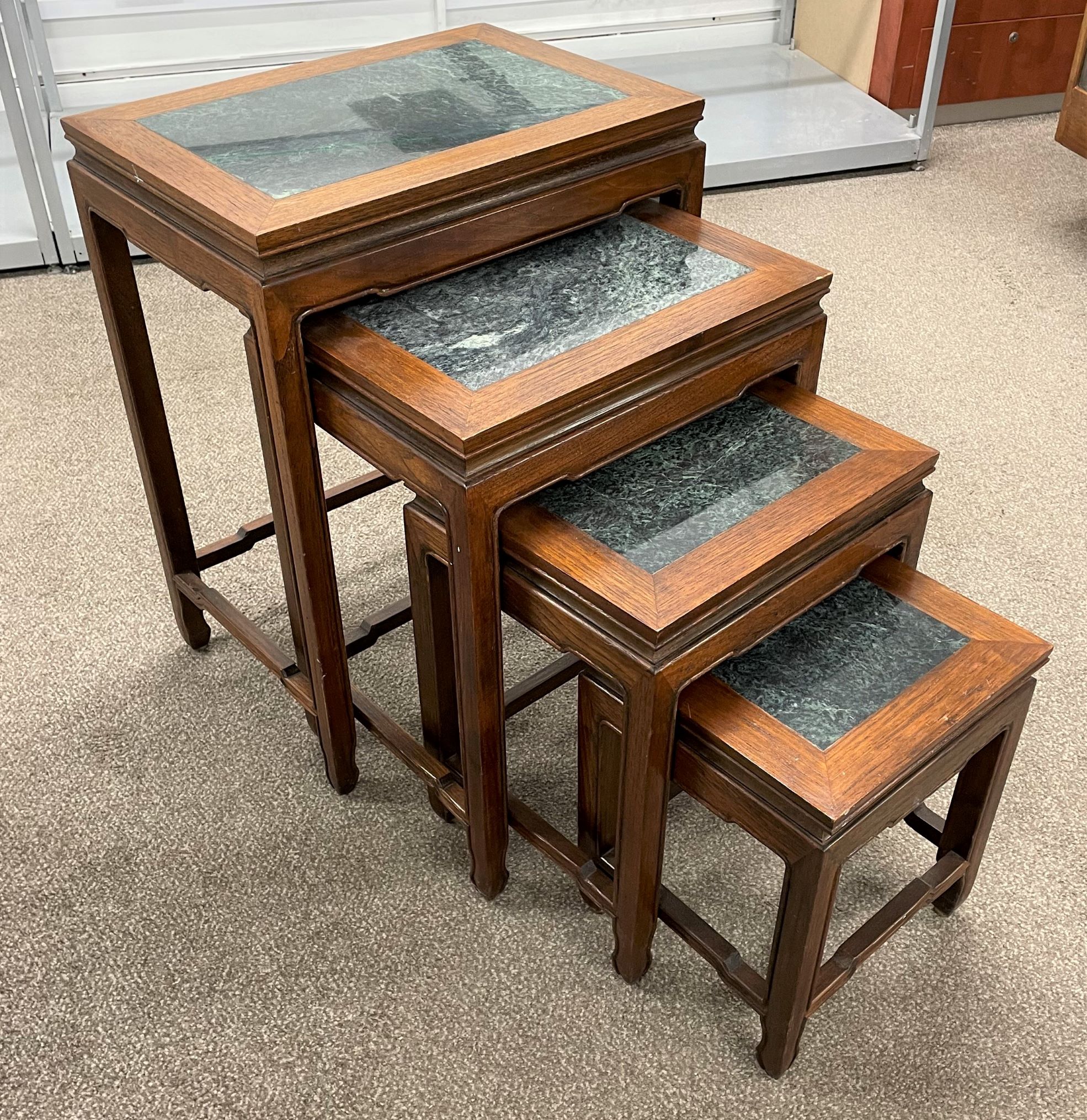 Nest of 4 granite top Oriental tables