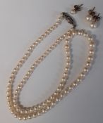 Graduated pearl necklace with silver clasp, pair of pearl stud earrings (butterflies marked 9ct) &