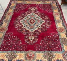 Red ground Persian tabriz  carpet with bespoke floral pattern 375cm by 298cm