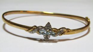 9ct diamond and aquamarine bangle - twist to fit wrist (has caused slight split) - total weight 4.