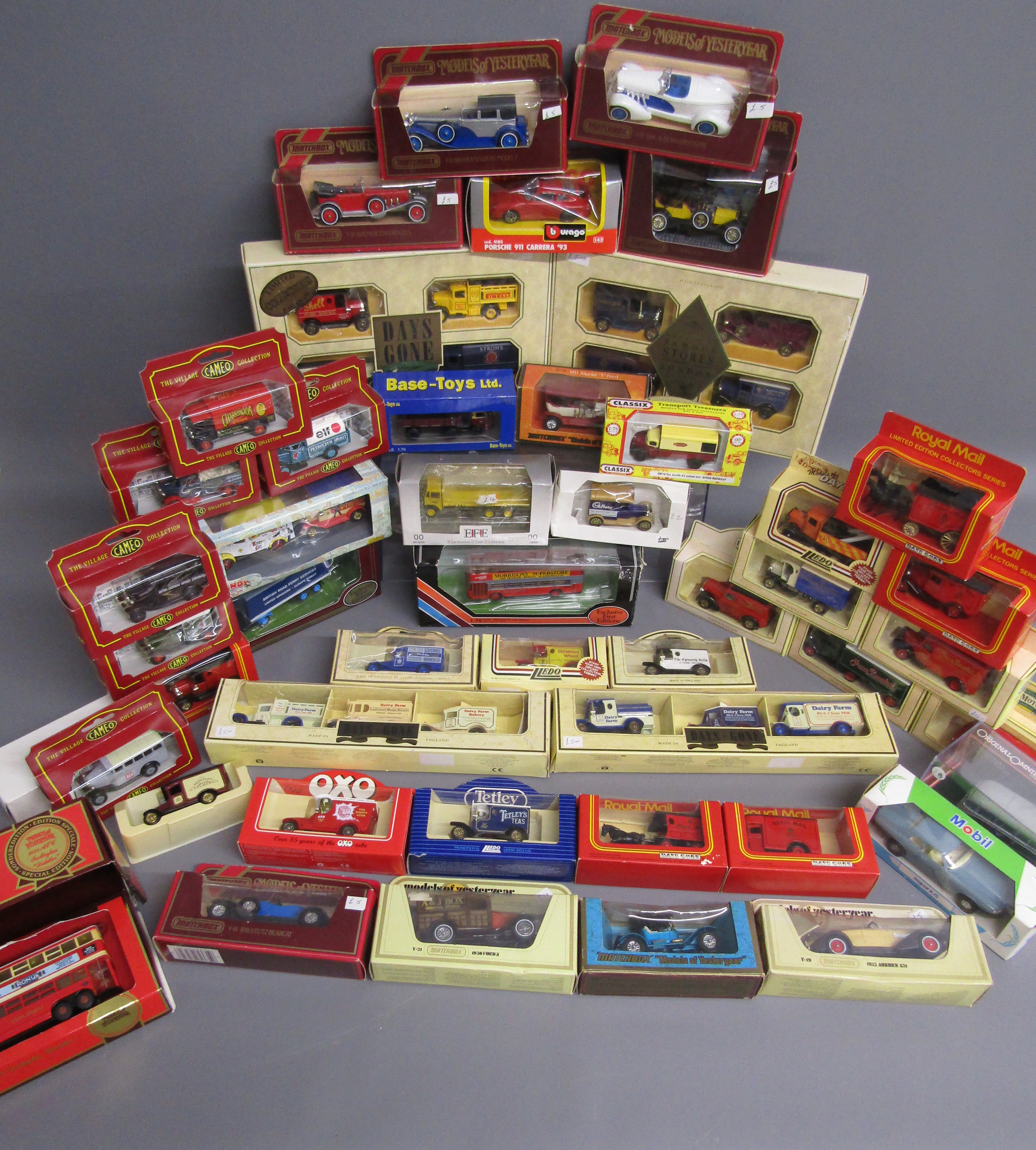 Collection of boxed cars includes Lledo Days Gone, Matchbox models of Yesteryear, Cameo Village