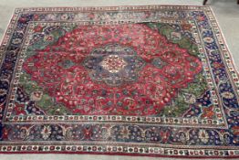 Multi coloured ground vintage Iranian handwoven carpet with floral medallion 296cm by 202cm