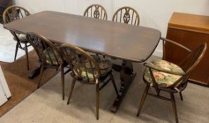 Ercol dark wood dining table & set of 6 Prince of Wales feather Ercol chairs