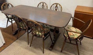 Ercol dark wood dining table & set of 6 Prince of Wales feather Ercol chairs