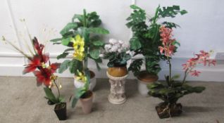 Collection of faux plants with pots