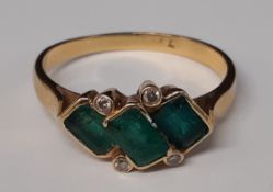 Tested as 18ct gold 3 stone emerald & diamond chip ring 4.2g, size V