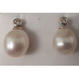 Pair of 18ct white gold, pearl & collet set diamond earrings (marked 750) 3.9g, 10mm pearls