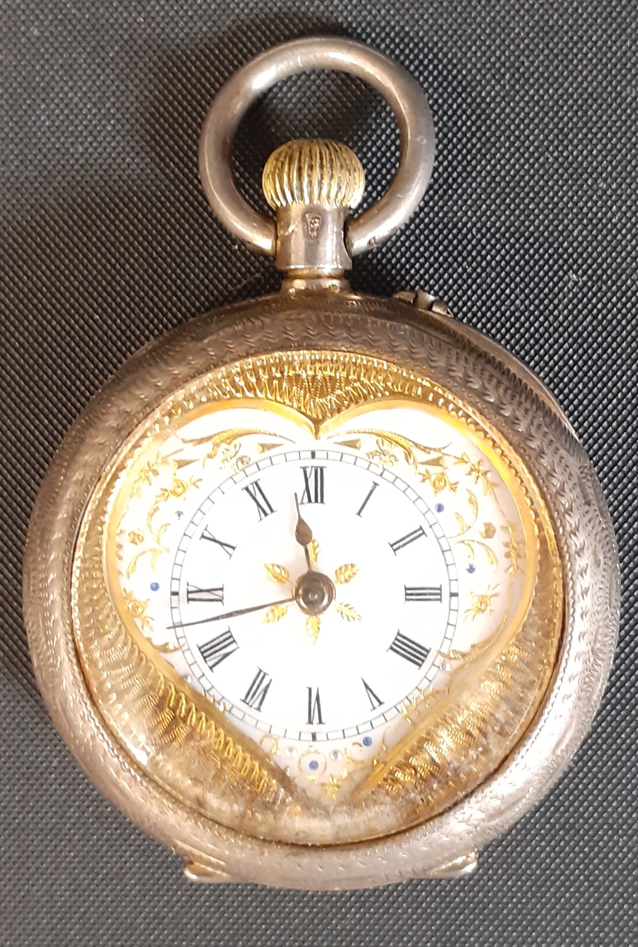 Continental silver gilt top wind fob watch marked 935 with engine turned case, heart shaped