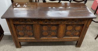 17th/18th century heavily carved oak coffer on stile legs with ring hinges L 129cm D 54cm Ht 59cm