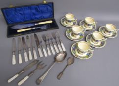 Crown Ducal 'Florentine' cups and saucers, cased fish knife and fork servers, cake knives and