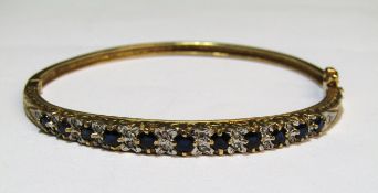 9ct gold diamond and sapphire hinged bangle - total weight 11.53g