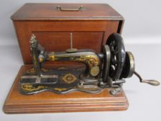 'New Family' 12k hand crank singer sewing machine circa 1883  with fiddle base, acanthus leaves