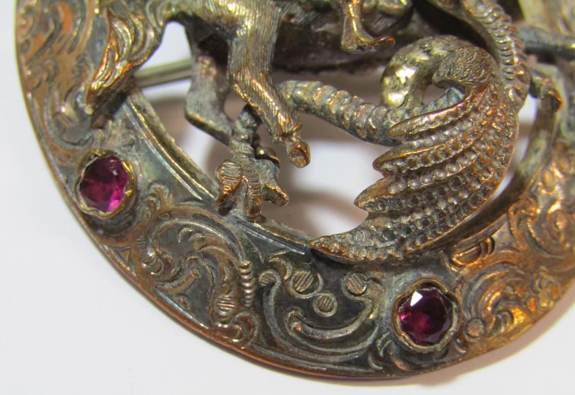 St George and the Dragon oval brooch with intricate detail edging set with glass stones (missing - Image 2 of 4