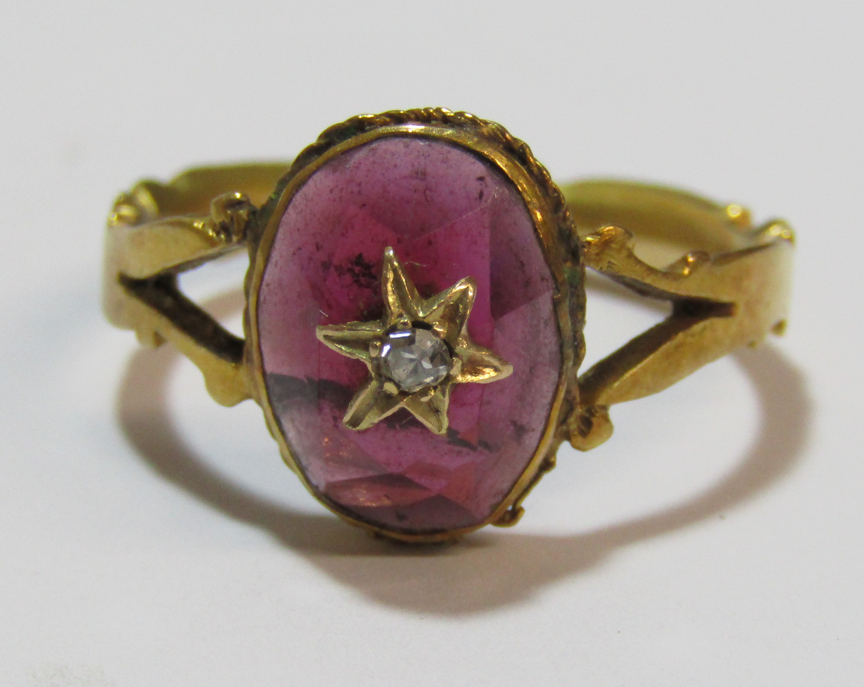 Tested as 18ct gold ring with oval garnet cabochon stone decorated with star design and single - Image 5 of 8