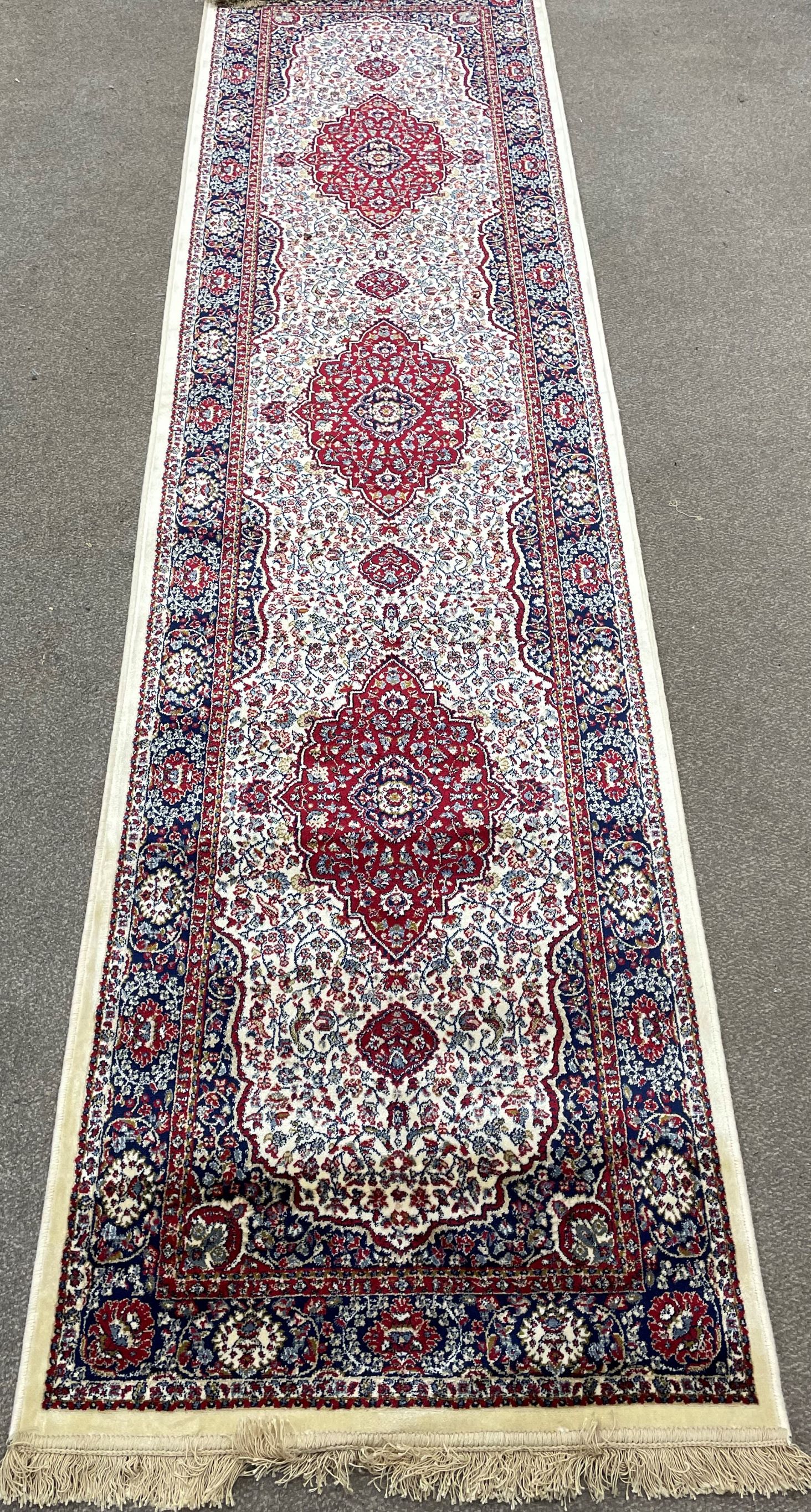 Ivory ground runner with floral medallion design 300cm by 80cm
