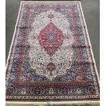 Ivory ground Persian carpet with traditional medallion design 230cm by 160cm