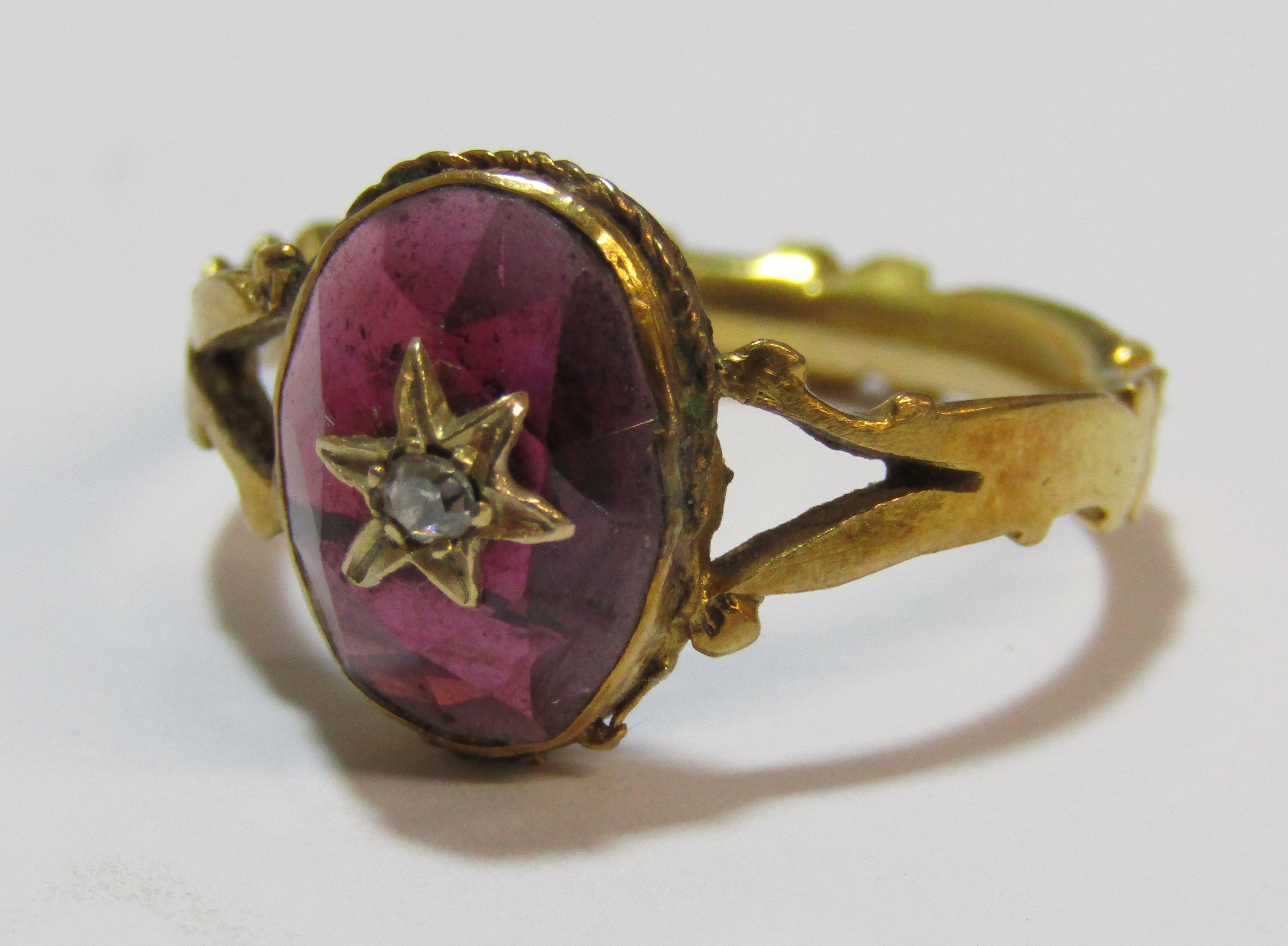 Tested as 18ct gold ring with oval garnet cabochon stone decorated with star design and single - Image 6 of 8