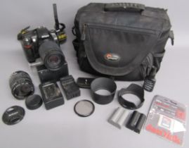 Nikon D70 camera with Nikon Nikkor 70-300mm lens, Sigma 18-12mm lens, 2 batteries, chargers and