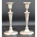 Pair early 20th silver candlesticks by George Unite Birmingham 1900 / 1902 (with loaded bases)