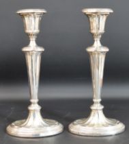 Pair early 20th silver candlesticks by George Unite Birmingham 1900 / 1902 (with loaded bases)