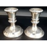 Pair of small silver candlesticks with loaded bases, Mappin & Webb London 1926