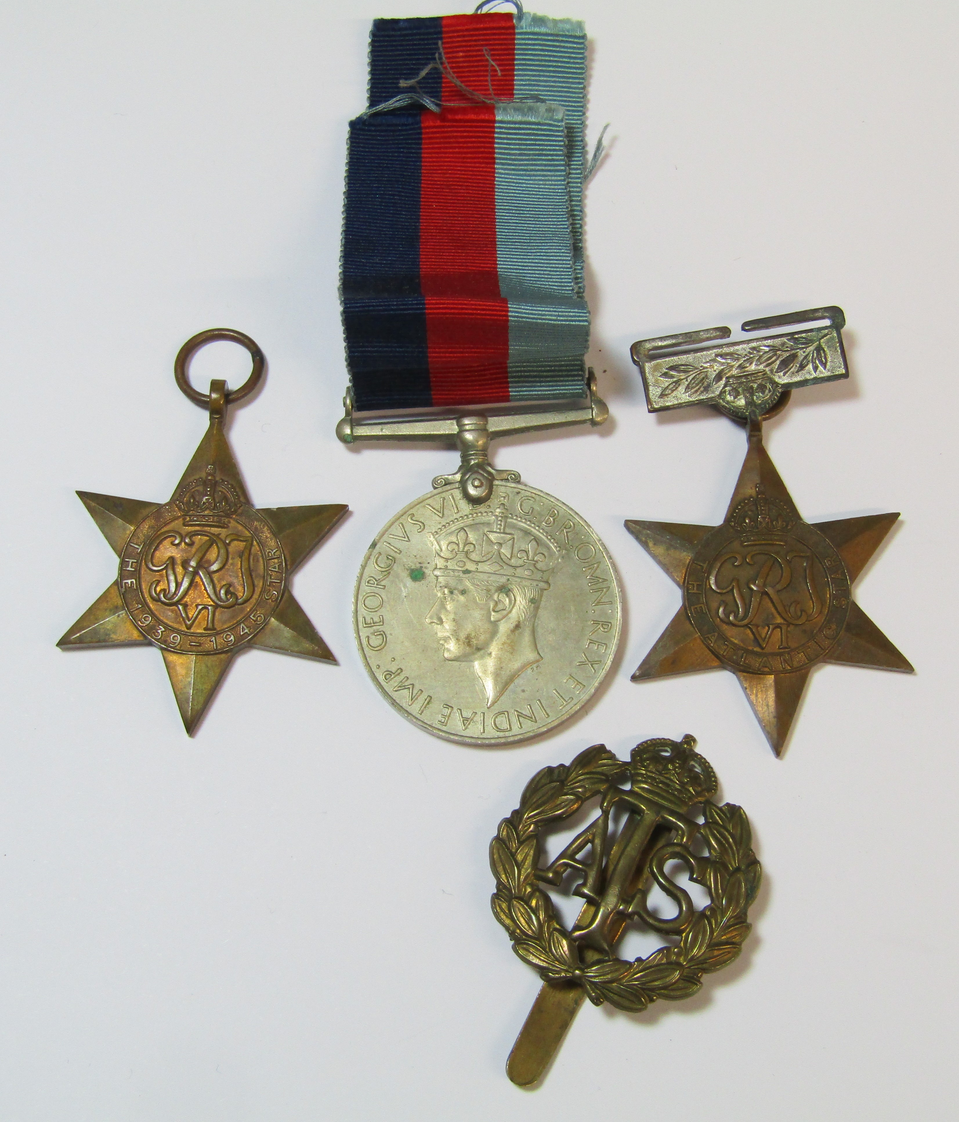 WWII medal, the 1939-1945 & Atlantic star and ATS cap badge