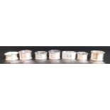 7 silver napkin rings 4.62ozt, and 2 plated napkin rings, various dates & designs