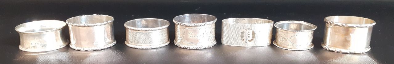 7 silver napkin rings 4.62ozt, and 2 plated napkin rings, various dates & designs