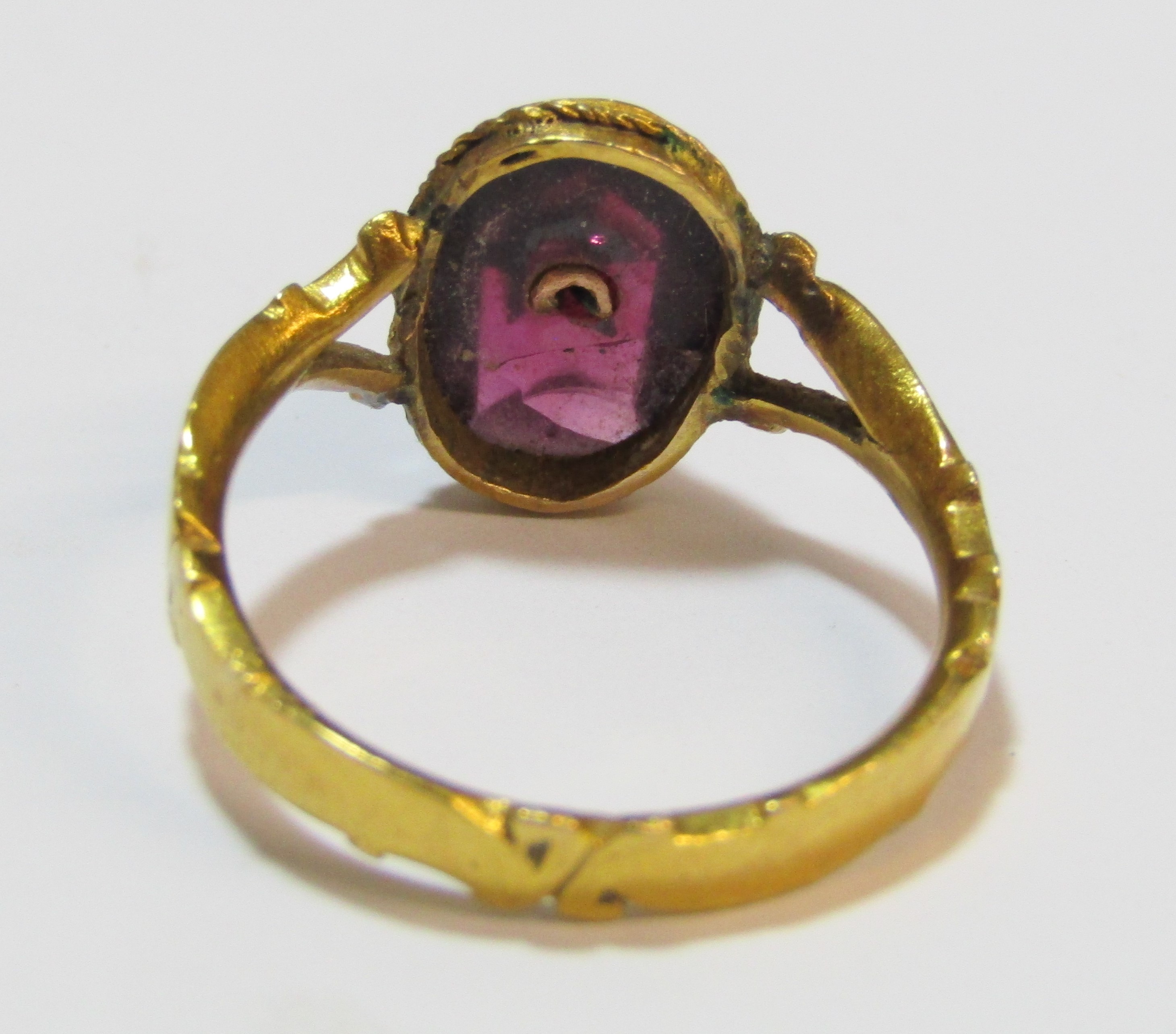 Tested as 18ct gold ring with oval garnet cabochon stone decorated with star design and single - Image 3 of 8