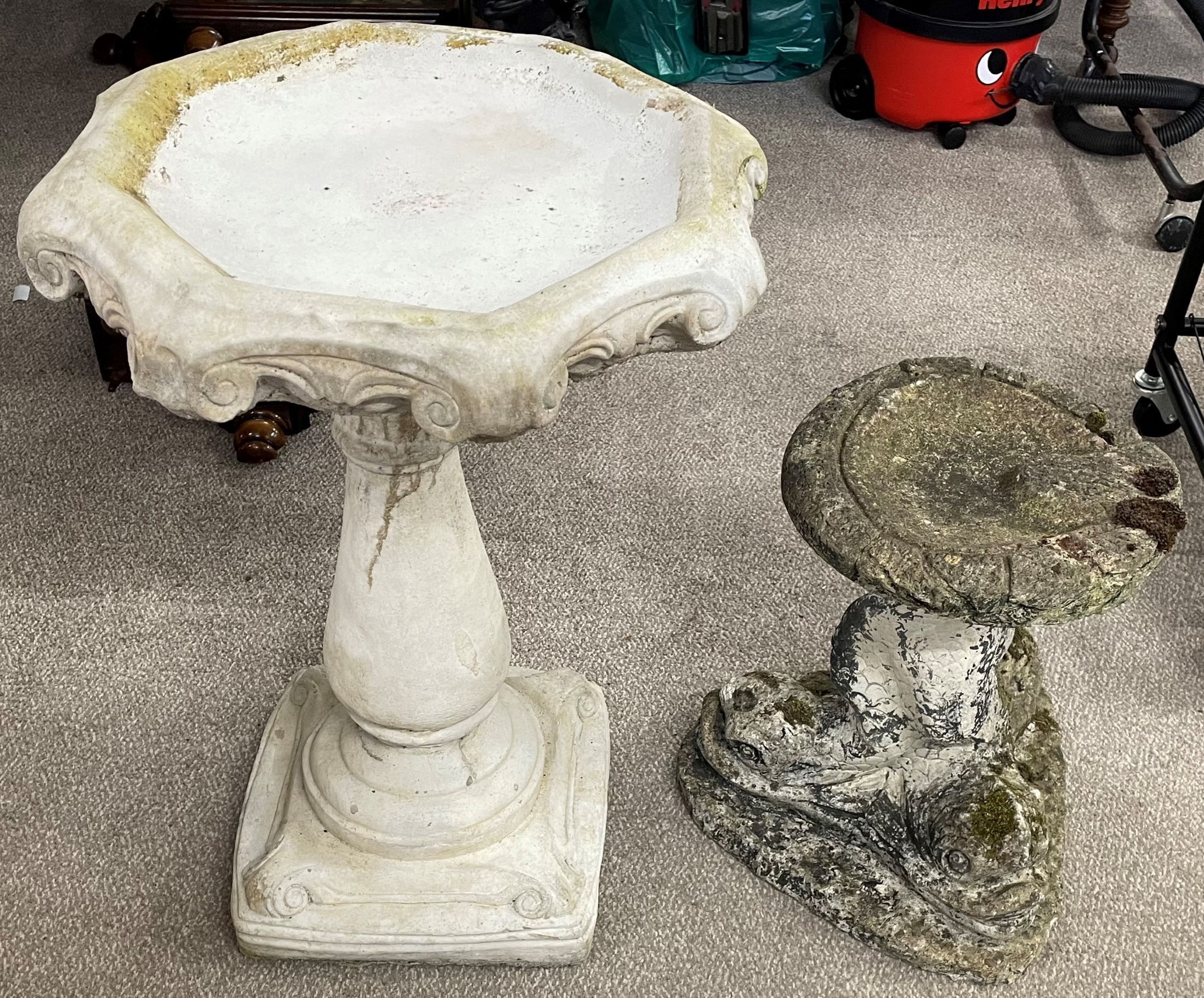 Two concrete bird baths