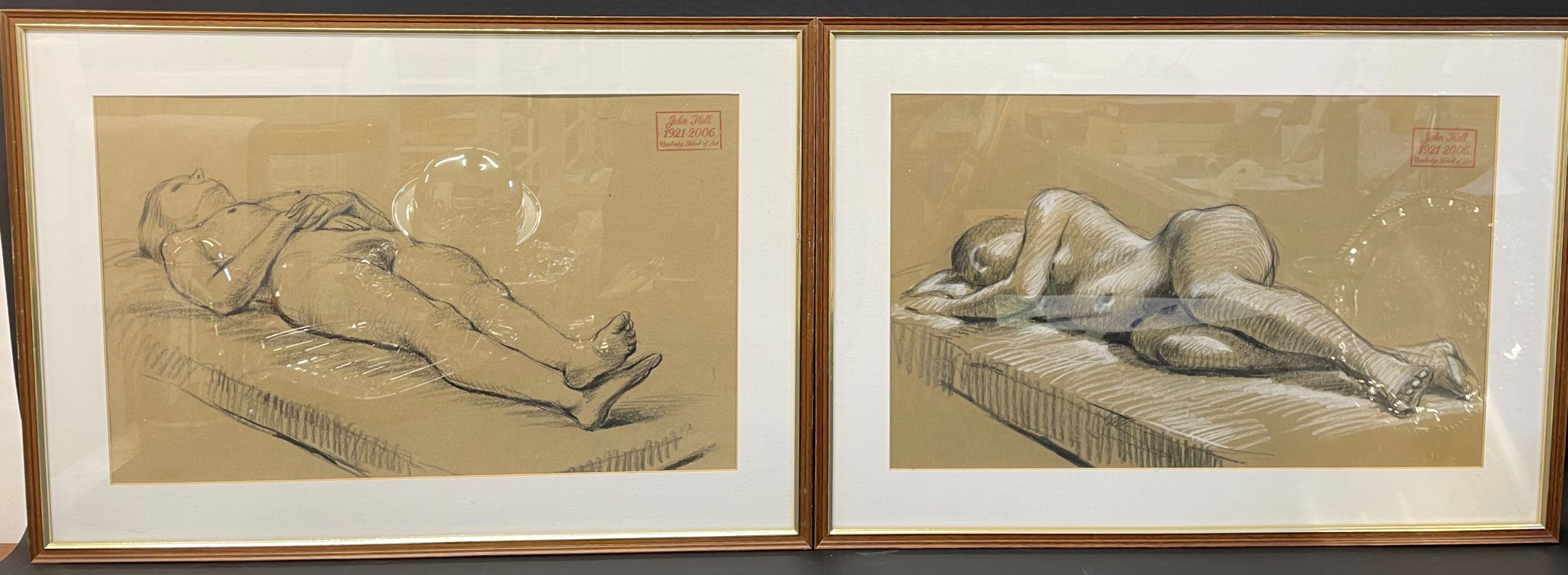 Pair of framed charcoal sketches of reclining nudes by John Hall with letter of provenance verso.