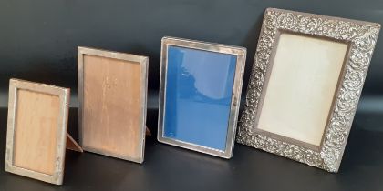 Victorian embossed silver photograph frame 19.5cm x 25.5cm, two smaller silver photograph frames &