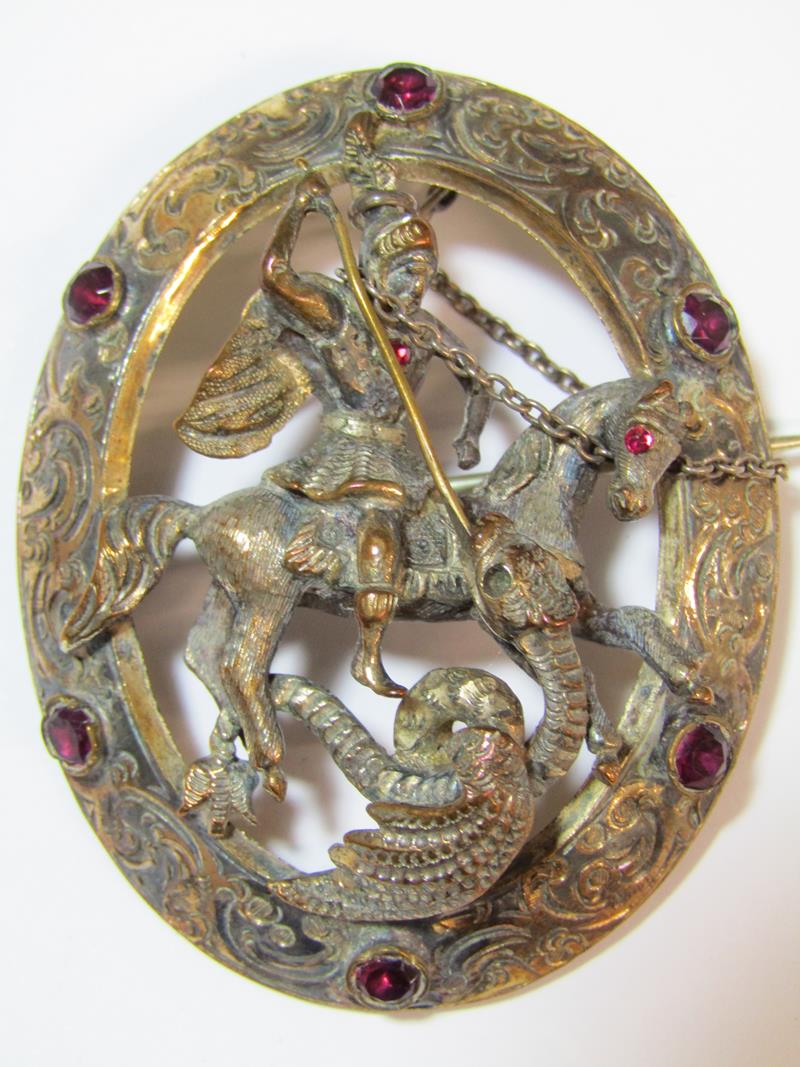 St George and the Dragon oval brooch with intricate detail edging set with glass stones (missing - Image 3 of 4