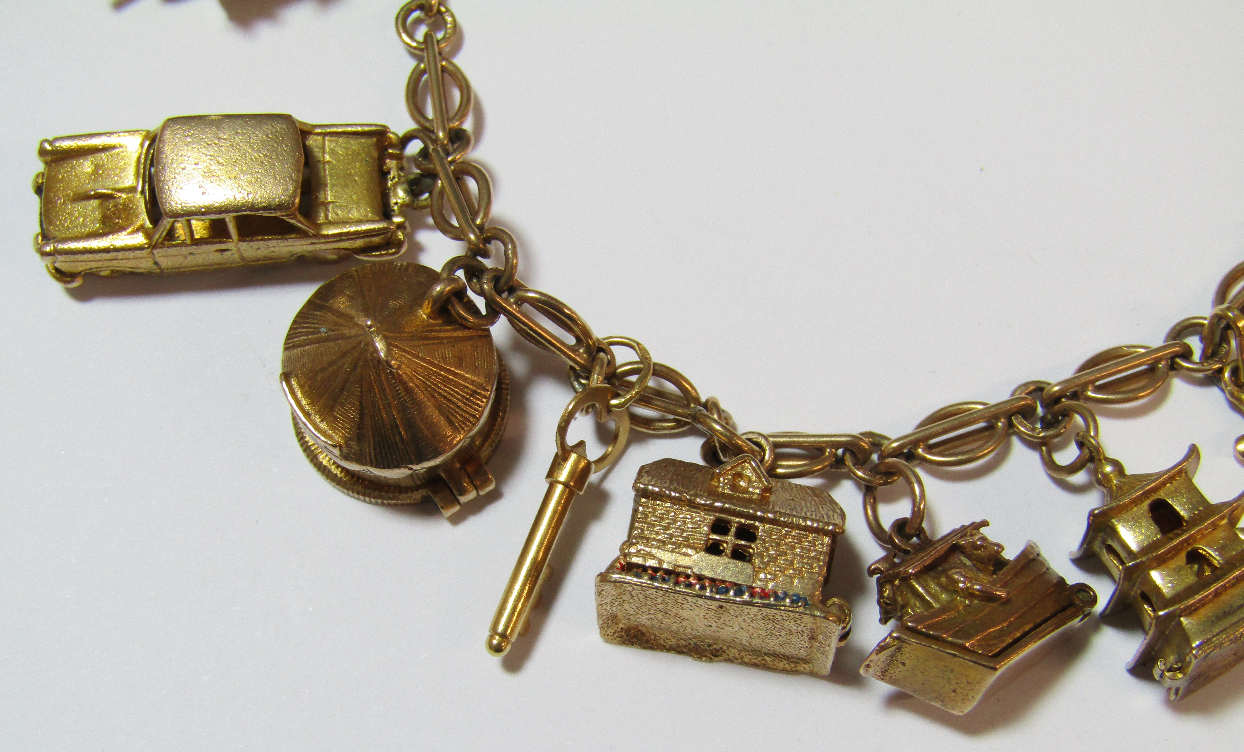 9ct gold charm bracelet - all charms appear hallmarked apart from 'Old Mother Hubbards Boot', - Image 2 of 8