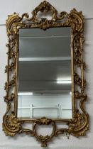 Large wall mirror with a gilded rococo frame 102cm by 57cm
