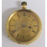 18k Swiss made gold open faced pocket watch with engine turned dial and floral design - engraved